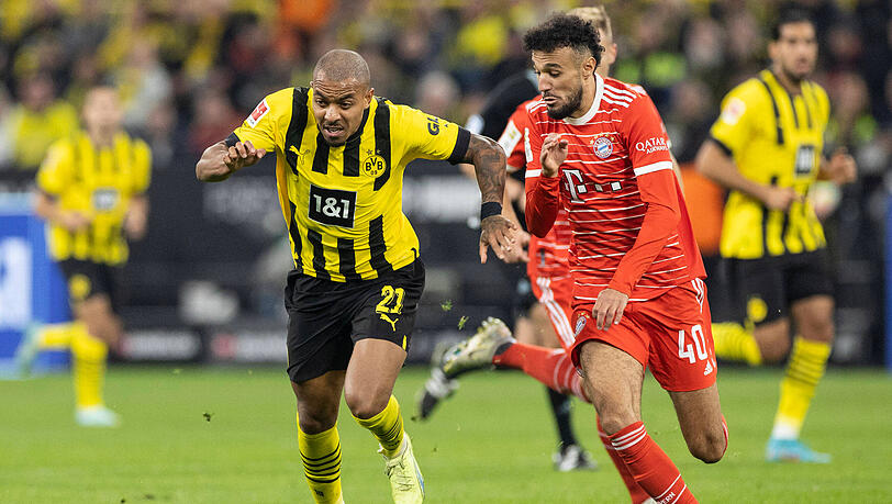 9. Spieltag der laufenden Saison: Dortmunds Donyell Malen (links) enteilt Bayern-Profi Nouassir Mazraoui.