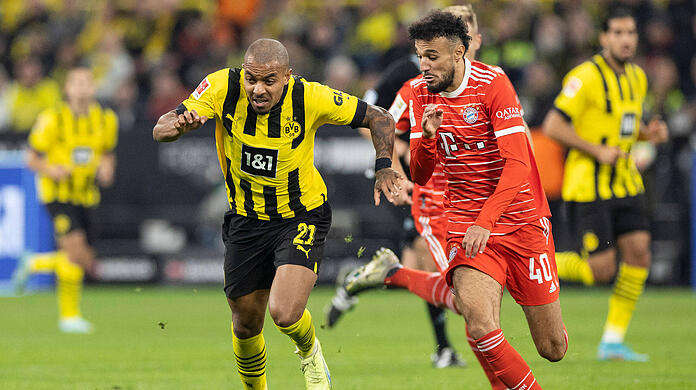 9. Spieltag der laufenden Saison: Dortmunds Donyell Malen (links) enteilt Bayern-Profi Nouassir Mazraoui.