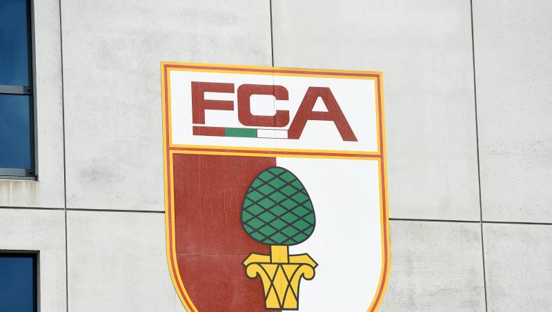Das Vereinswappen des FC Augsburg. Foto: Tobias Hase/dpa/Archivbild Das Vereinswappen des FC Augsburg. Foto: Tobias Hase/dpa/Archivbild