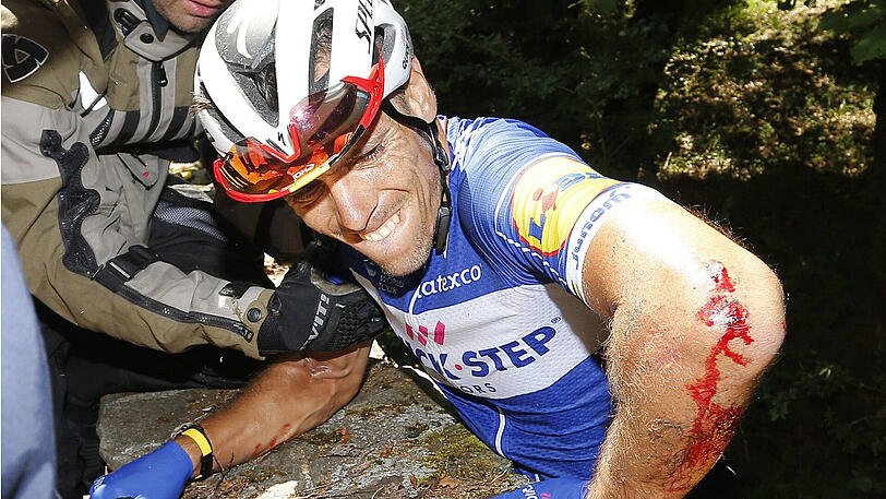 Nach dem Sturz über die Mauer: Der belgische Radprofi Philippe Gilbert kommt wieder nach oben - die Bilder.