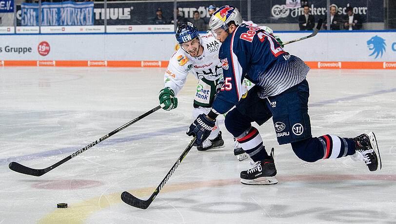 Showdown in München: EHC-Profi Derek Joslin im Duell mit dem Augsburger Hans Detsch (links). Showdown in München: EHC-Profi Derek Joslin im Duell mit dem Augsburger Hans Detsch (links).