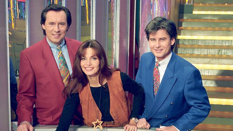 Kultige Dauerwerbesendung: „Glücksrad“ mit Frederic Meisner (r), Maren Gilzer und Peter Bond. Kultige Dauerwerbesendung: „Glücksrad“ mit Frederic Meisner (r), Maren Gilzer und Peter Bond.