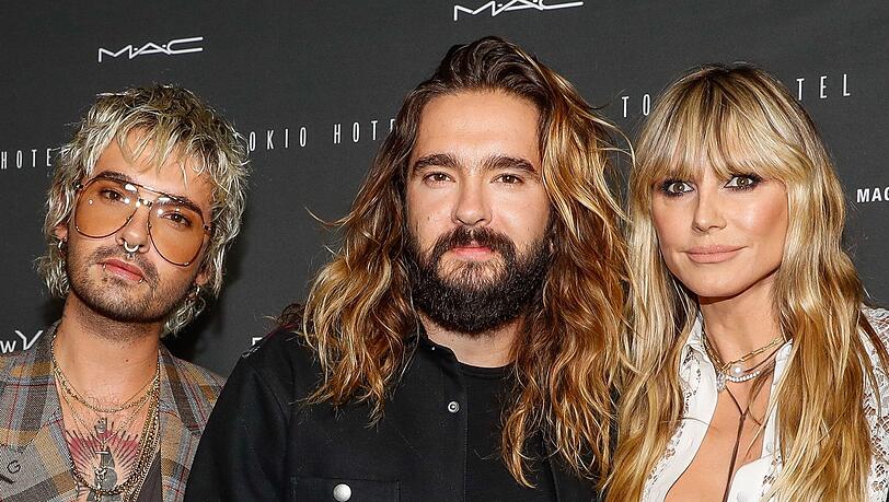 Tom Kaulitz (in der Mitte) spricht ein Machtwort gegen seinen Zwillingsbruder Bill Kaulitz und seine Ehefrau Heidi Klum aus.