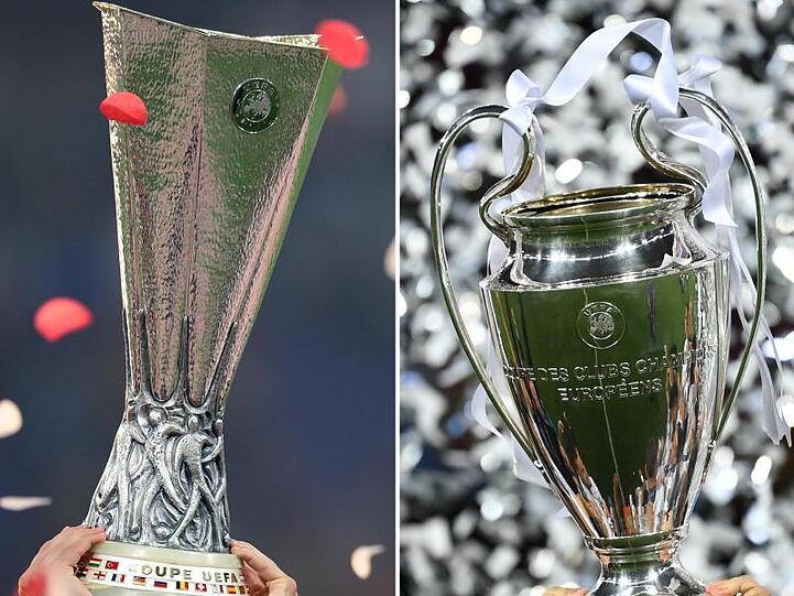 Die Pokal der Europa League (l) und der Champions League.