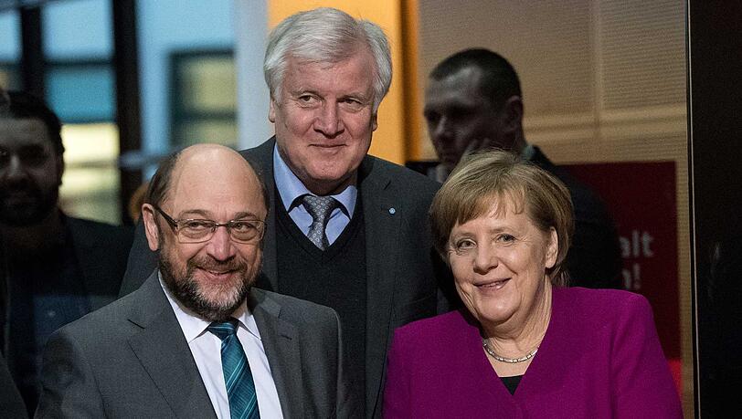 Gehen eine Koalition ein: SPD-Chef Martin Schulz, CSU-Chef Horst Seehofer und CDU-Chefin Angela Merkel. Gehen eine Koalition ein: SPD-Chef Martin Schulz, CSU-Chef Horst Seehofer und CDU-Chefin Angela Merkel.