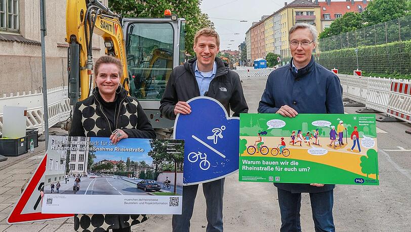 Baureferentin Jeanne-Marie Ehbauer (v.l.), Zweiter Bürgermeister Dominik Krause und Mobilitätsreferent Georg Dunkel posieren, nebenan wettert der Vorsitzende des BA Schwabing-Freimann. Baureferentin Jeanne-Marie Ehbauer (v.l.), Zweiter Bürgermeister Dominik Krause und Mobilitätsreferent Georg Dunkel posieren, nebenan wettert der Vorsitzende des BA Schwabing-Freimann.
