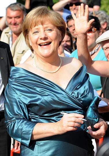 Merkel fühlt sich auch sichtlich wohl...