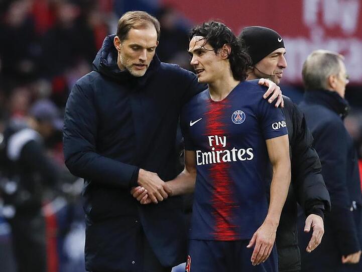 Thomas Tuchel (l) muss gegen Manchester United auch auf Edinson Cavani verzichten.