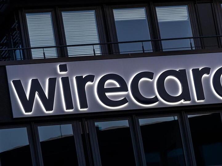 Der Schriftzug von Wirecard an der Firmenzentrale des Zahlungsdienstleisters in Aschbeim. Foto: Peter Kneffel/dpa/Archivbild