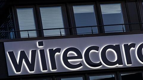 Der Schriftzug von Wirecard an der Firmenzentrale des Zahlungsdienstleisters in Aschbeim. Foto: Peter Kneffel/dpa/Archivbild