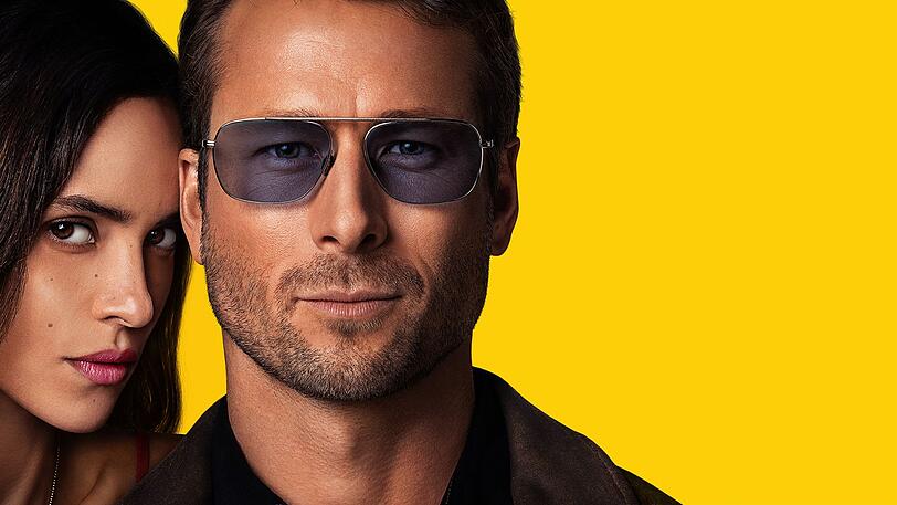 Gary (Glen Powell) entwickelt ein nicht immer professionell distanziertes Verhältnis zu Madison (Adria Arjona), deren Pläne er als Aushilfspolizist eigentlich überwachen sollt. Gary (Glen Powell) entwickelt ein nicht immer professionell distanziertes Verhältnis zu Madison (Adria Arjona), deren Pläne er als Aushilfspolizist eigentlich überwachen sollt.