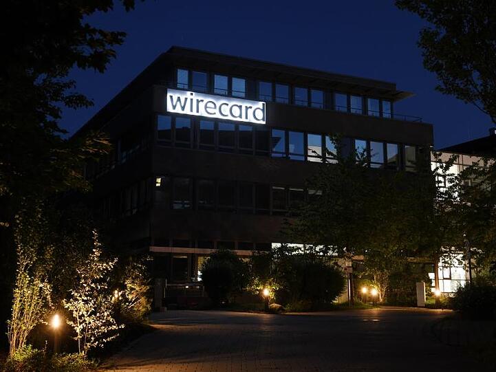 Der Schriftzug von Wirecard ist an der Firmenzentrale des Zahlungsdienstleisters zu sehen. Foto: Tobias Hase/dpa/Archivbild