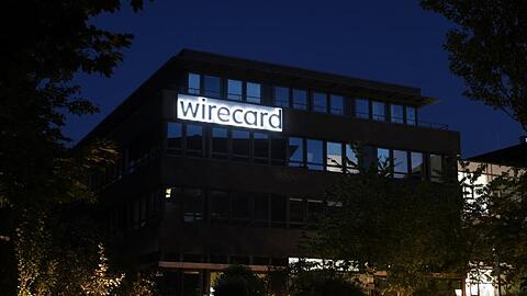 Der Schriftzug von Wirecard ist an der Firmenzentrale des Zahlungsdienstleisters zu sehen. Foto: Tobias Hase/dpa/Archivbild
