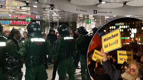 Eingekesselt am Stachus: Die Polizei bildet einen Korridor, um die "Bagida"-Anhänger unbeschadet zur S-Bahn zu geleiten. Währenddessen rufen die "Platz da! München ist bunt!-Teilnehmer "Nazis raus!"