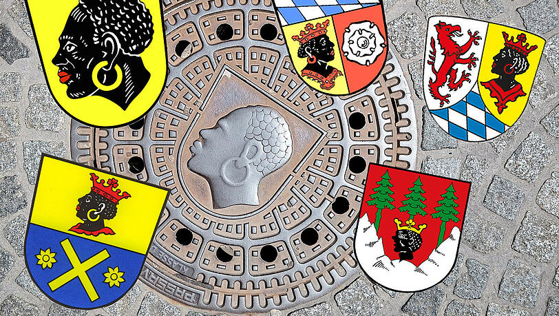 Der "Coburger Mohr" ist auf Kanaldeckeln in der dortigen Innenstadt zu sehen. Petitionen streiten über die Änderung des Coburger, aber auch anderer Wappen von Städten, Landkreisen und Gemeinden. Neben der Stadt in Oberfranken tragen unter anderem auch der Landkreis Garmisch-Partenkirchen, Eching, Mittenwald und der Landkreis Freising solche Darstellungen in ihren Wappen. Der "Coburger Mohr" ist auf Kanaldeckeln in der dortigen Innenstadt zu sehen. Petitionen streiten über die Änderung des Coburger, aber auch anderer Wappen von Städten, Landkreisen und Gemeinden. Neben der Stadt in Oberfranken tragen unter anderem auch der Landkreis Garmisch-Partenkirchen, Eching, Mittenwald und der Landkreis Freising solche Darstellungen in ihren Wappen.
