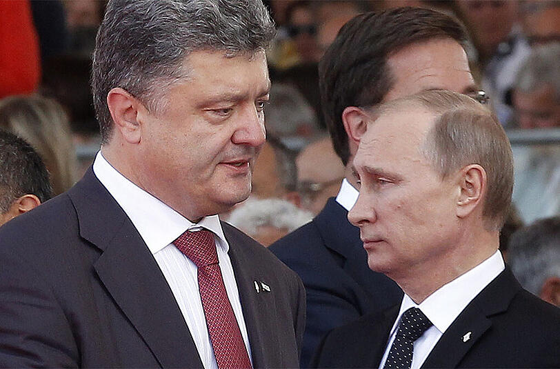 Der ukrainische Präsident Petro Poroschenko (l.) mit dem russischen Staatschef Wladimir Putin.