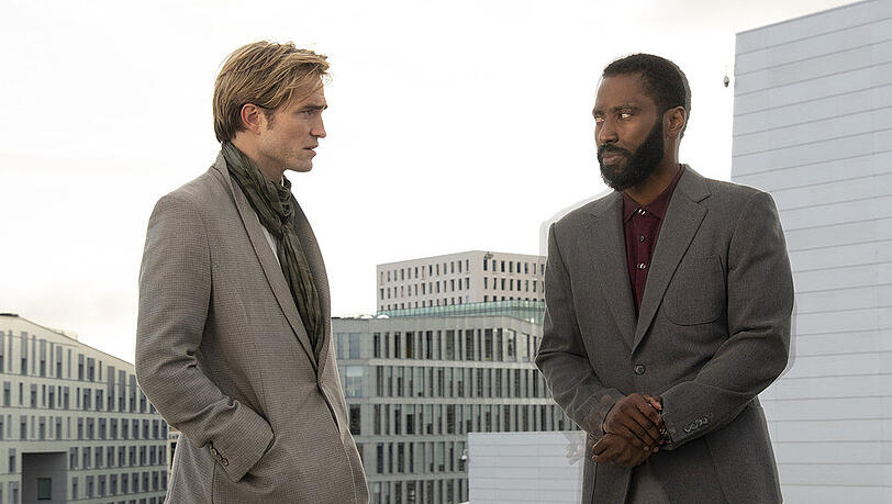 John David Washington (r.) und Robert Pattinson verspäten sich etwas zum Kino-Reboot. John David Washington (r.) und Robert Pattinson verspäten sich etwas zum Kino-Reboot.