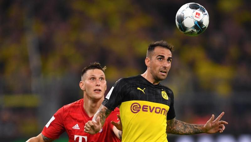 Bayerns Niklas Süle und Dortmunds Paco Alcácer im Kopfballduell. Foto: Marius Becker Bayerns Niklas Süle und Dortmunds Paco Alcácer im Kopfballduell. Foto: Marius Becker