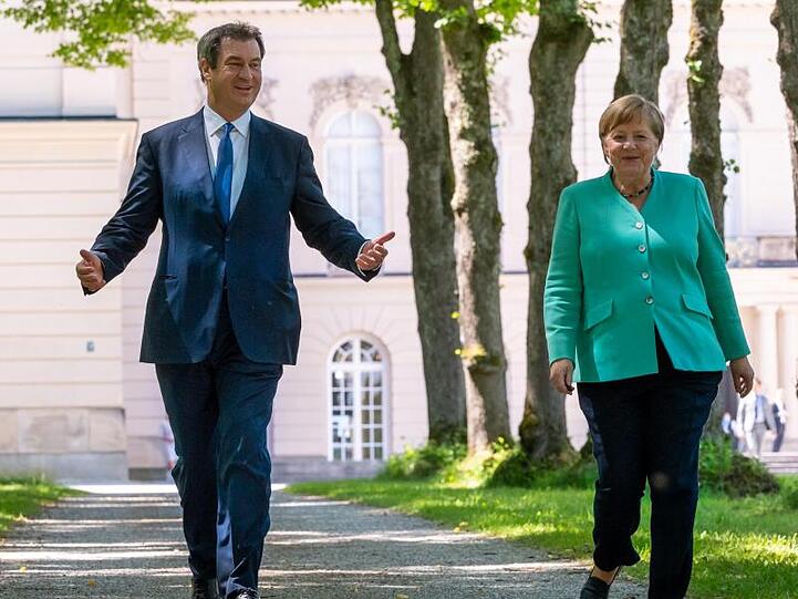 Markus Söder (CSU), Ministerpräsident von Bayern, und Bundeskanzlerin Angela Merkel (CDU). Foto: Peter Kneffel/dpa/Pool/dpa