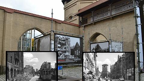 Große Plakatwände zeigen die Zerstörung Münchens nach dem 2. Weltkrieg.