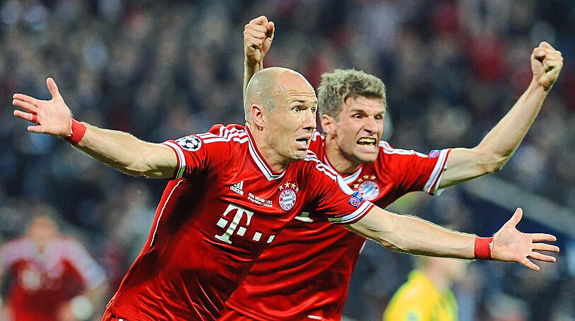Triumph: Müller und Robben (l.) bejubeln den Siegtreffer des Holländers im Finale gegen Borussia Dortmund.