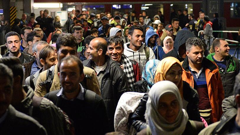 Flüchtlinge kommen am Hauptbahnhof in München an. Flüchtlinge kommen am Hauptbahnhof in München an.