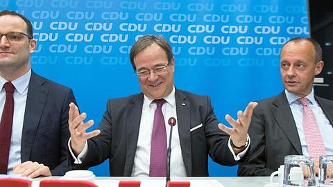 Gesundheitsminister Jens Spahn (l-r), NRW-Ministerpräsident Armin Laschet und Friedrich Merz.