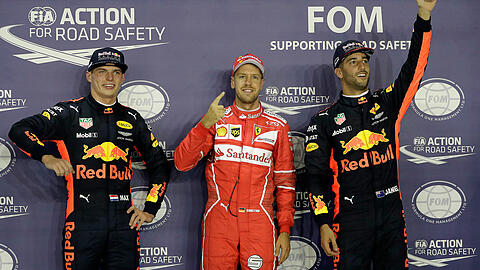 Sebastian Vettel sicherte sich die Pole Position im Großen Preis von Singapur vor den Red-Bull-Fahrern Max Verstappen (2., links) und Daniel Ricciardo (3., rechts).