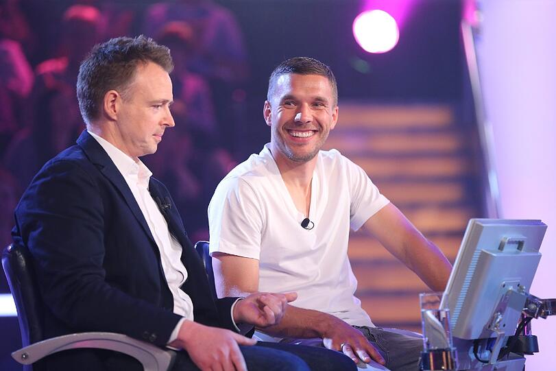 Lukas Podolski mit DFB-Kocj Holger Stromberg.