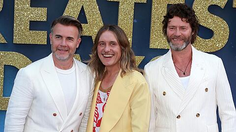 Mark Owen (Mitte) setzte in den vergangenen Jahren an der Seite von Gary Barlow (l.) und Howard Donald auf ein wilderes Aussehen.