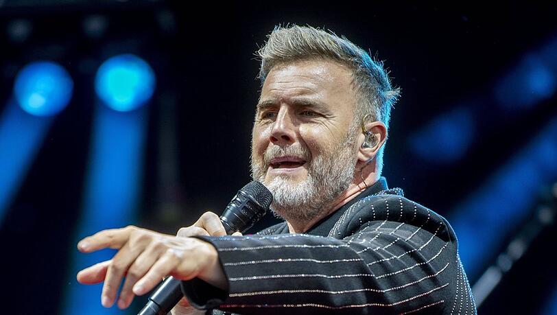 Seit 2005 steht Gary Barlow wieder mit Take That auf der Bühne. Die Band hat inzwischen nur noch drei Mitglieder. 2026 geht es auf große Tour durch Großbritannien und Irland.