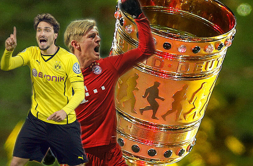 Mats Hummels (l) und Toni Kroos wollen ihn: Um diesen Pokal geht es beim Finale im Berliner Olympiastadion am 17. Mai