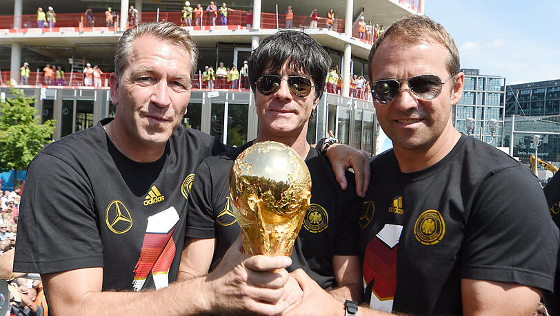 Weltmeister-Duo: Löw und Assistent Flick 2014. Weltmeister-Duo: Löw und Assistent Flick 2014.