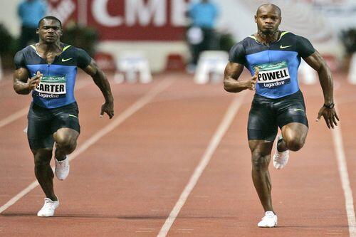 Asafa Powell (re.), hier im Kampf gegen seinen jamaikanischen Landsmann Nesta Carter, will Olympia-Gold.