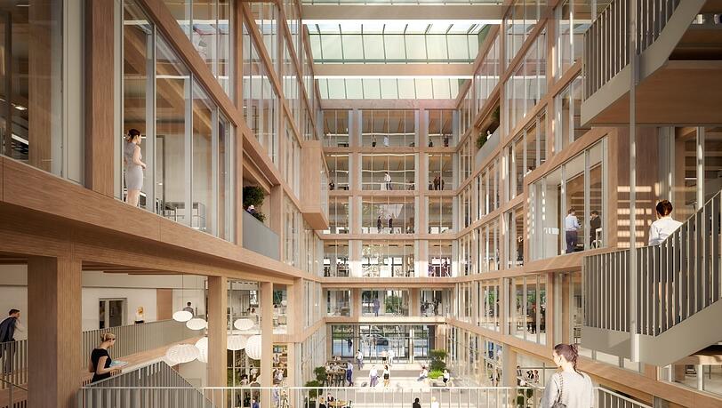 Holz überall, auch im 650 Quadratmeter großen Atrium in der Gebäudemitte. Den Bau hat das dänische Architekturbüro C.F. Møller entworfen. Holz überall, auch im 650 Quadratmeter großen Atrium in der Gebäudemitte. Den Bau hat das dänische Architekturbüro C.F. Møller entworfen.