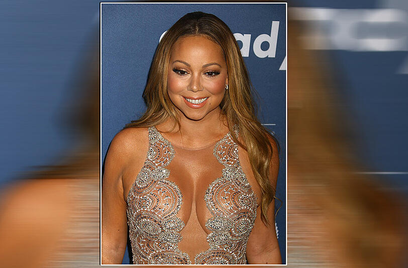 Warum geizen mit den Reizen? Das denkt sich auch Mariah Carey in ihrem hautengen Glitzerkleid.