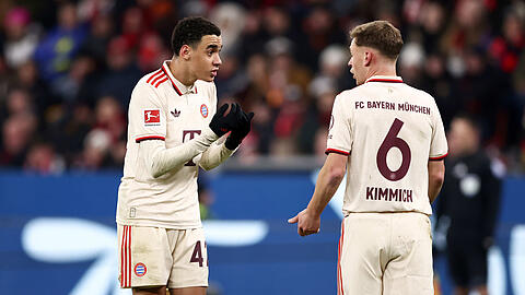 Auf Nationalspieler wie Jamal Musiala (l.) und Joshua Kimmich kommt ein äußerst arbeitsreicher Sommer zu.