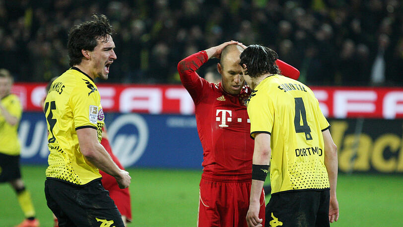 11. April 2012, Bundesliga: Dortmund sorgt mit dem 1:0-Sieg für die Vorentscheidung im Titelrennen. Lewandowski trifft per Hacke zum Sieg. Robben (m.) vergibt die große Chance zum Ausgleich, als er mit einem Foulelfmeter an Roman Weidenfeller scheitert.