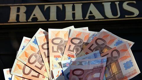 L&auml;nder mit hochverschuldeten Kommunen sollen Geld vom Bund bekommen. (Illustration)
