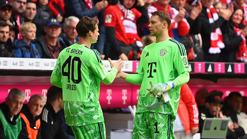 Platzhirsch und Thronfolger: Manuel Neuer (r.) und Jonas Urbig bilden beim FC Bayern ein harmonisches Torwart-Duo. Platzhirsch und Thronfolger: Manuel Neuer (r.) und Jonas Urbig bilden beim FC Bayern ein harmonisches Torwart-Duo.
