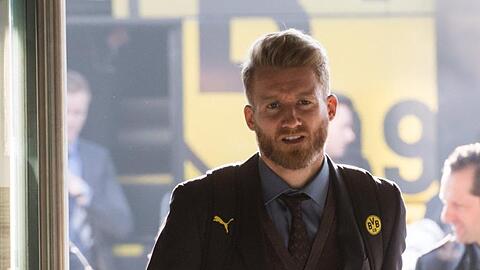 Der frühere Fußballnationalspieler André Schürrle kommt an einen Flughafen.