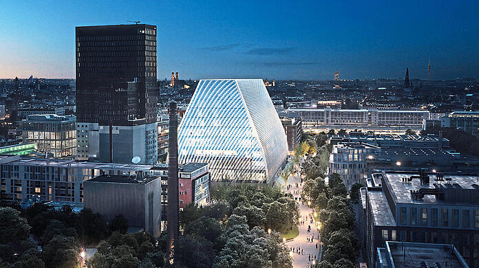 Das geplante Konzerthaus im Werksviertel hinter dem Ostbahnhof, dessen Lichter im Hintergrund rechts leuchten. Der Entwurf für den Bau stammt vom Bregenzer Atelier der Architekten Andreas Cukrowicz und Anton Nachbaur-Sturm.