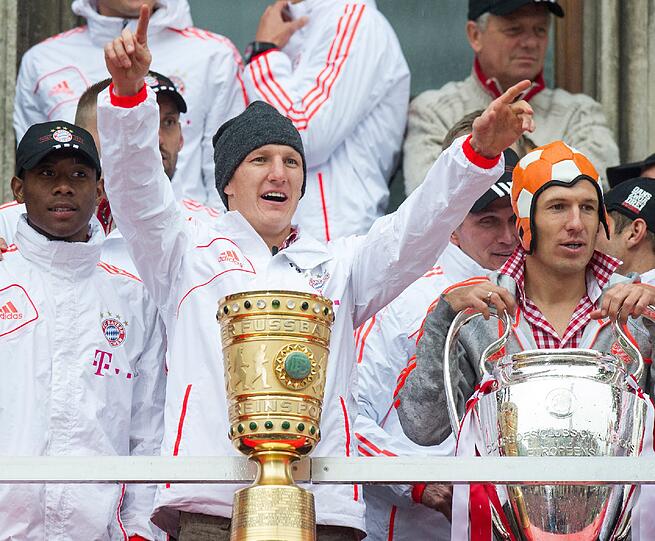 "Mia san Triple". Die Bilder von der Bayern-Siegesfeier am Sonntag.