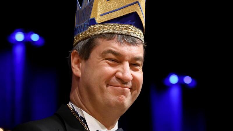 Ministerpräsident Markus Söder (CSU) trägt eine Narrenkappe und lächelt. Foto: Daniel Karmann/dpa/Archivbild Ministerpräsident Markus Söder (CSU) trägt eine Narrenkappe und lächelt. Foto: Daniel Karmann/dpa/Archivbild