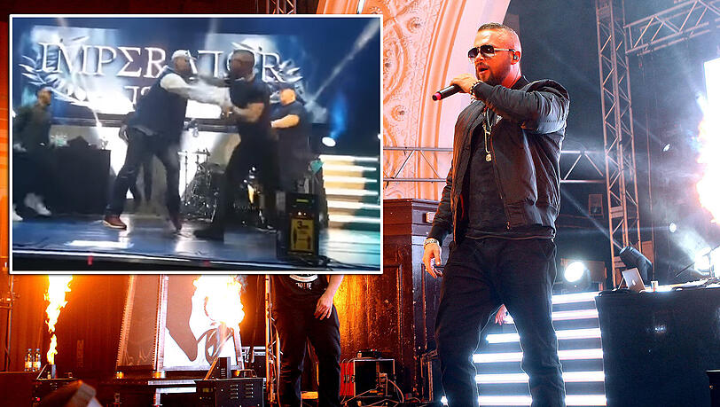 Kollegah wird von einem Fan bedrängt und schlägt zu. Kollegah wird von einem Fan bedrängt und schlägt zu.