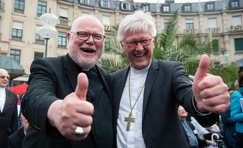 Es gibt viel zu tun, packen wir&rsquo;s an &ndash; in Christi Namen! Kardinal Reinhard Marx (li.) und EKD-Ratspräsident Heinrich Bedford-Strohm in München.
