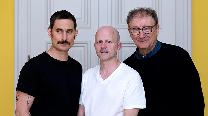 Die Schauspieler Clemens Schick und Rainer Bock.mit Regisseur RP Kahl in der Mitte - hier beim Filmfest München.
