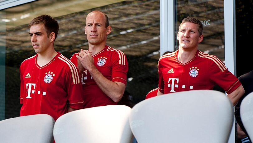 Arjen Robben mit Philipp Lahm (l.) und Bastian Schweinsteiger, die er indirekt kritisiert hat. Arjen Robben mit Philipp Lahm (l.) und Bastian Schweinsteiger, die er indirekt kritisiert hat.