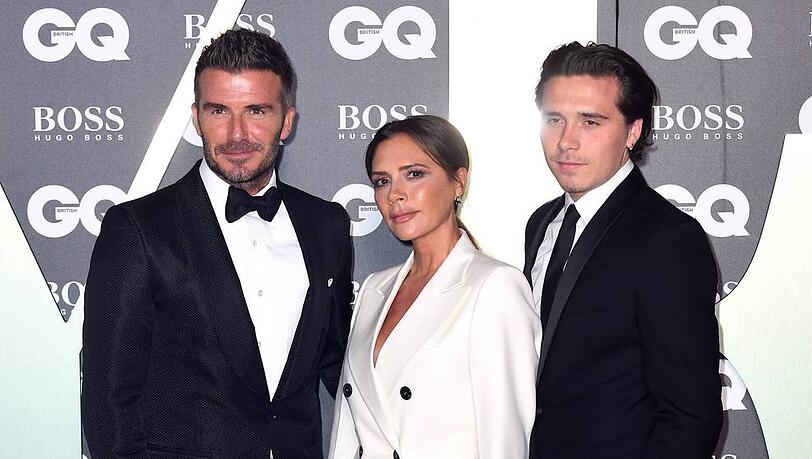 David Beckham (l.) mit seiner Frau Victoria und Sohn Brooklyn bei den "GQ Men Of The Year Awards" David Beckham (l.) mit seiner Frau Victoria und Sohn Brooklyn bei den "GQ Men Of The Year Awards"