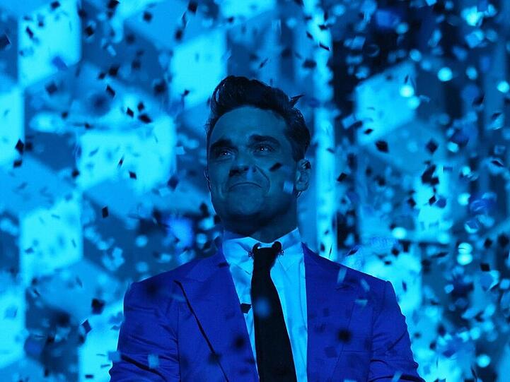 Genießt das Tourleben als Glitzerwelt mit bösen Folgen: Robbie Williams